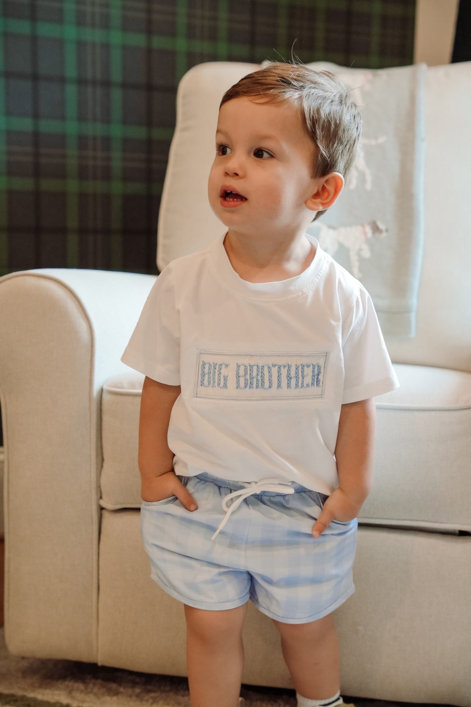 Toddler boy wearing a Big Brother embroidered shirt with blue plaid shorts, perfect for sibling photos, baby announcements, and welcoming a new baby