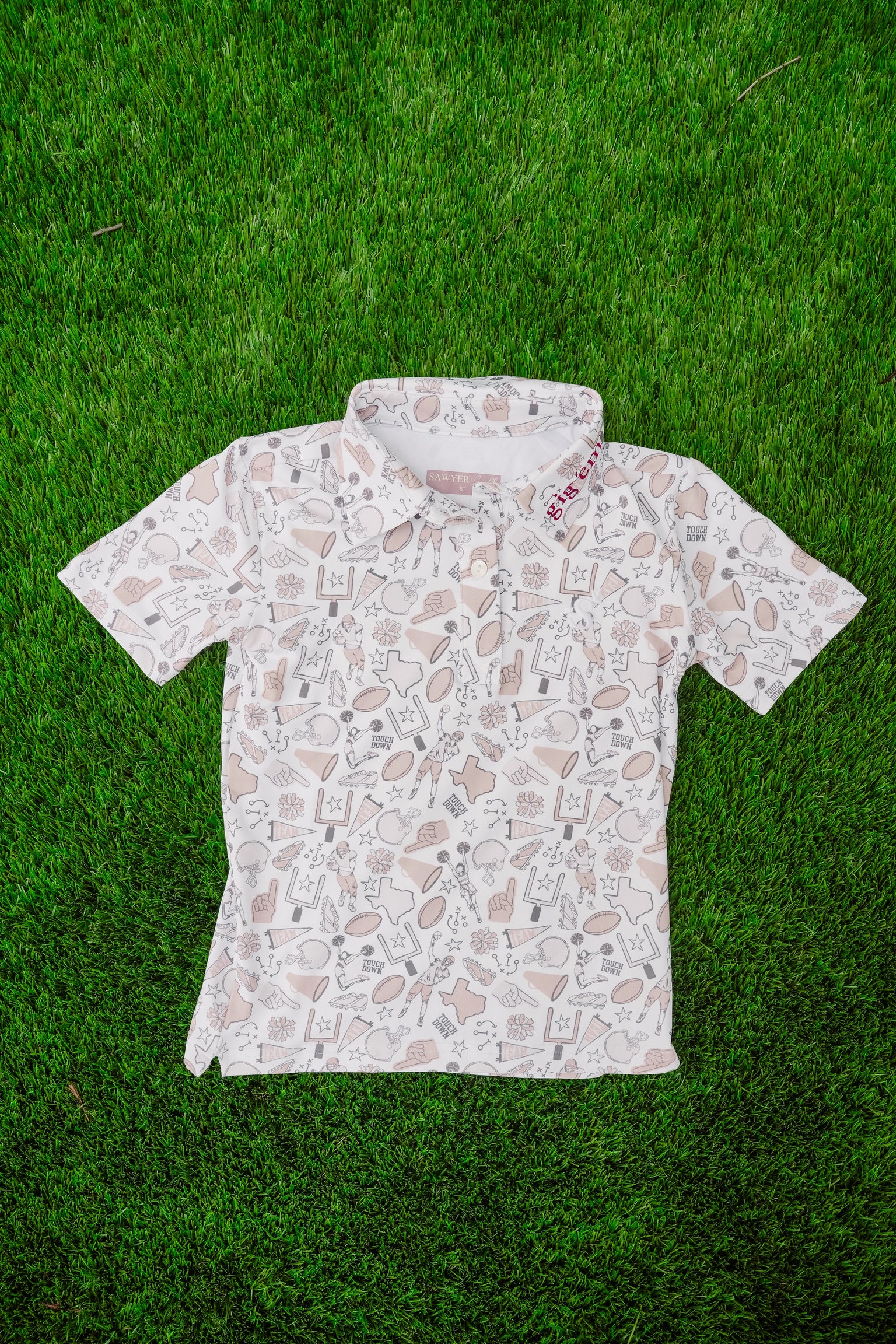 Short-sleeve shirt with a pattern on a grass background