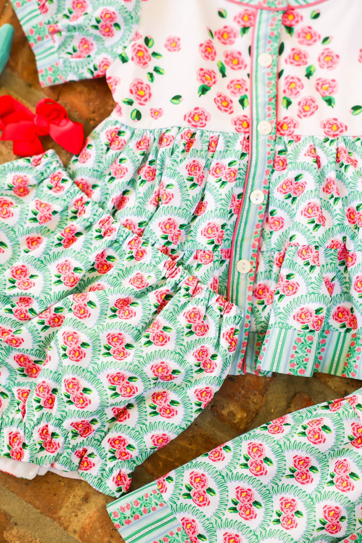 Floral patterned fabric with pink flowers and green details
