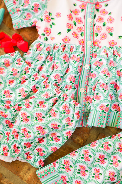 Floral patterned fabric with pink flowers and green details
